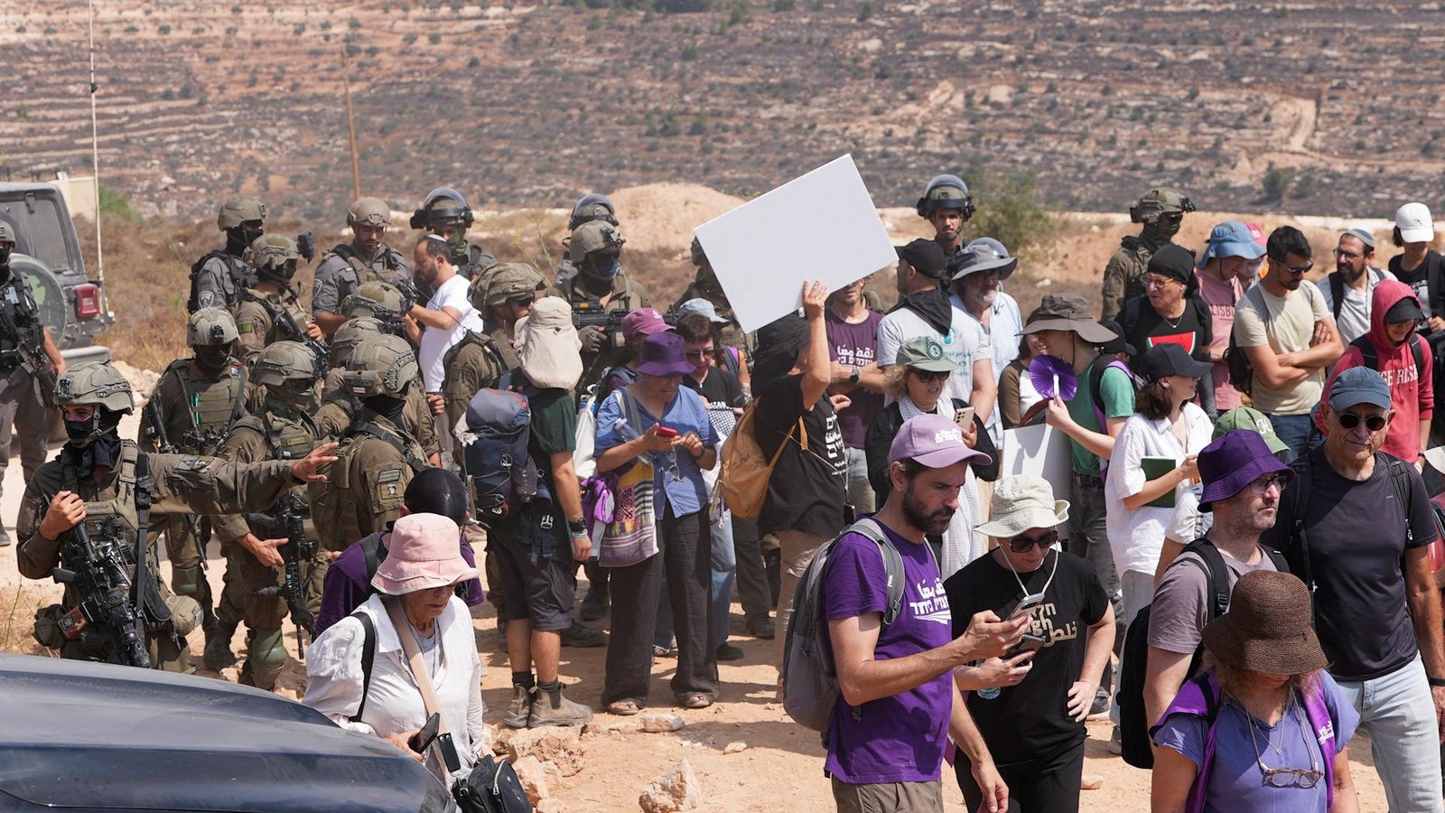 Israeli soldiers prevent aid delivery to besieged Palestinians